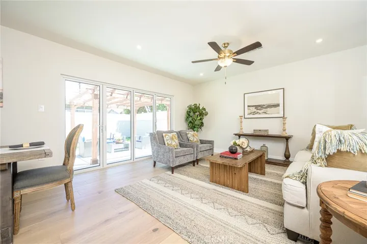 The accordion glass door in the back living room offers the perfect blend of indoor-outdoor living and leads to the private enclosed backyard with a large patio and manicured yard perfect for outdoor fun and
entertainment.