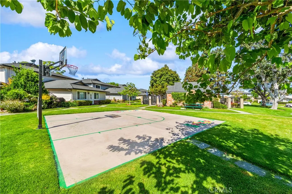 Sports court with ample green space.