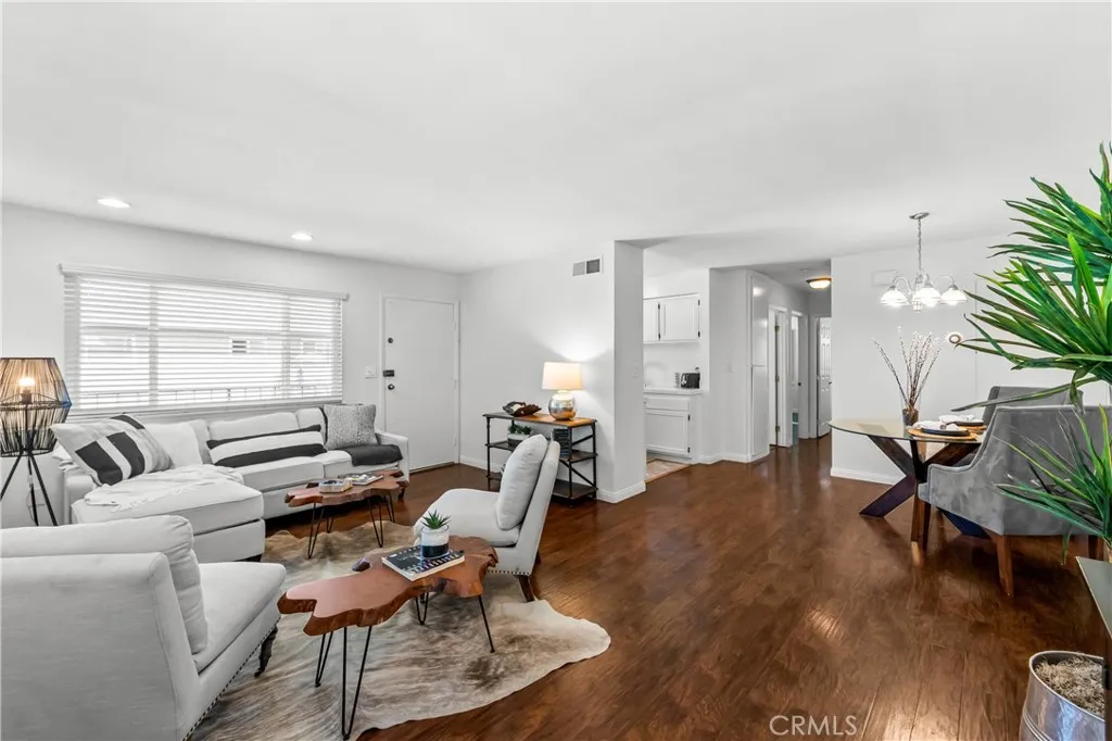 Looking towards the front door from the entertainment wall. Open concept living a good space to entertain friends and family.