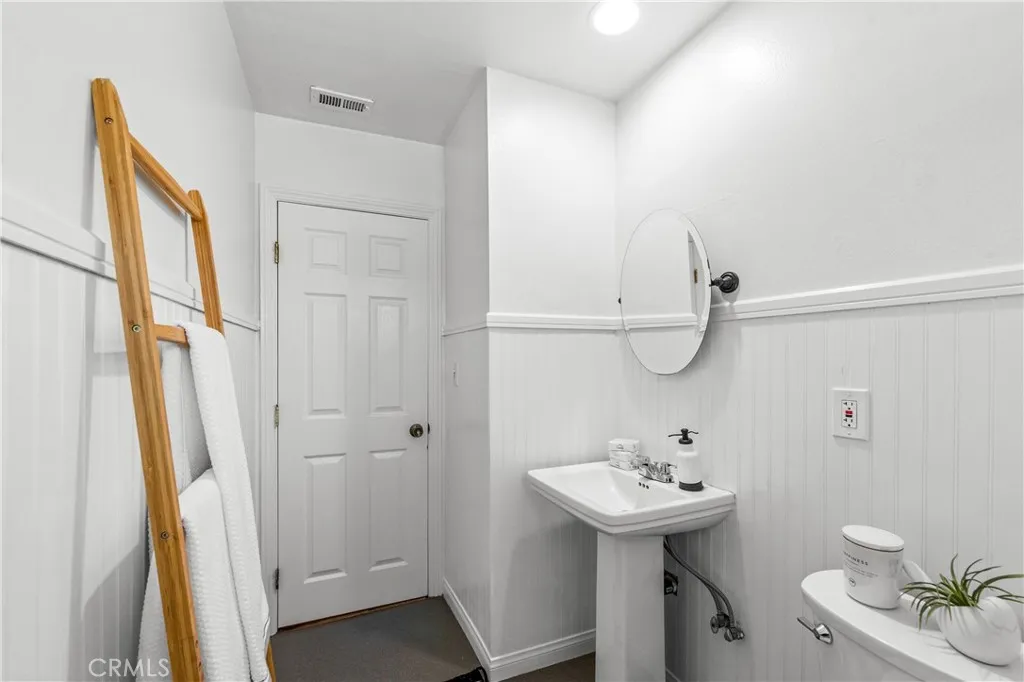 View looking out from the tub -the wall by the sink is a hall closet-easily converted to more bathroom space or a linen cabinet.