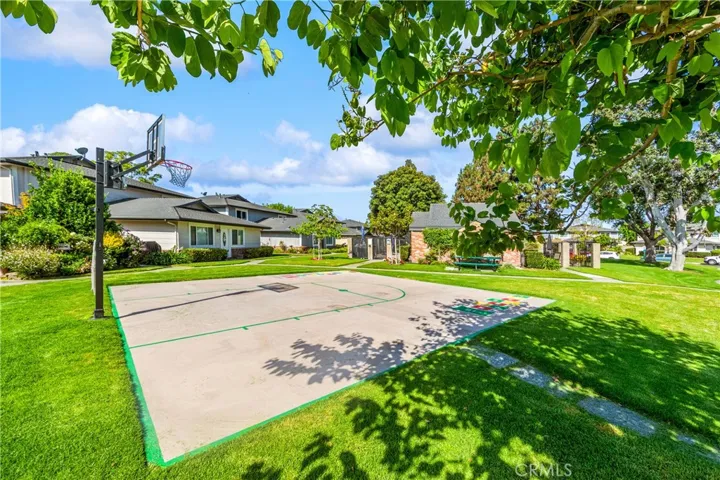 Sports court with ample green space.