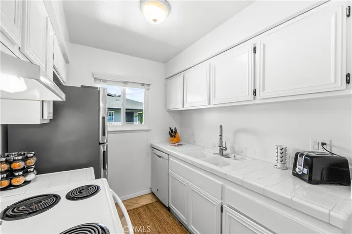 The opposite side of the galley kitchen/good light and lots of counter space.