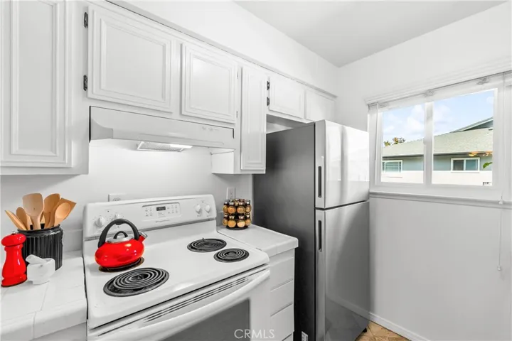 Freshly painted kitchen-walls and cabinets-it can work for now. Live in it and then make it your own.