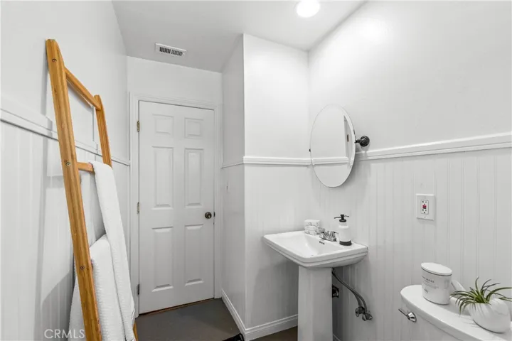 View looking out from the tub -the wall by the sink is a hall closet-easily converted to more bathroom space or a linen cabinet.