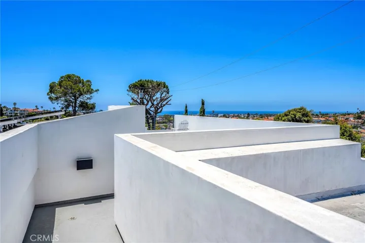 Roof top deck with ocean and city views