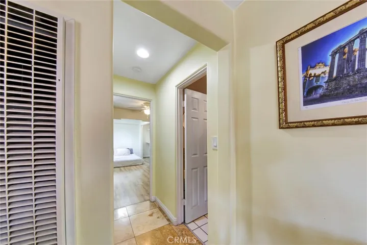 Hallway with second bathroom and third bedroom