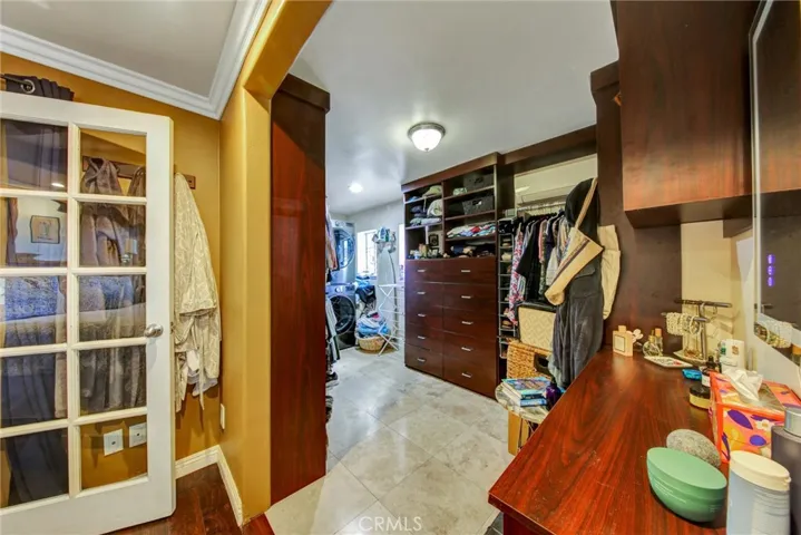 Custom walk-in closet view from primary bedroom.