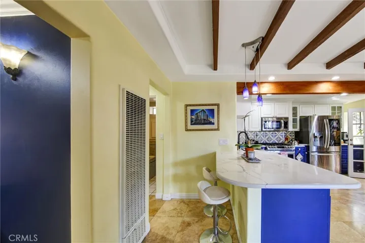 Kitchen view with living room entrance off to left