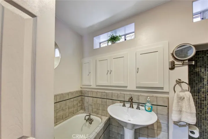 Another view of second bathroom with separate tub and shower
