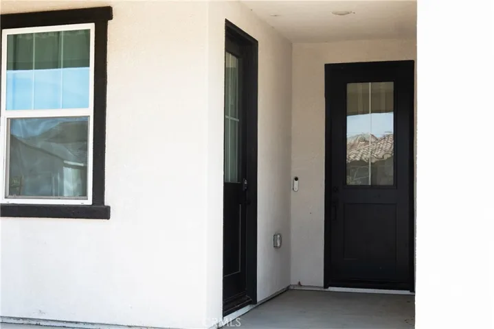 Front door and door of guest unit.