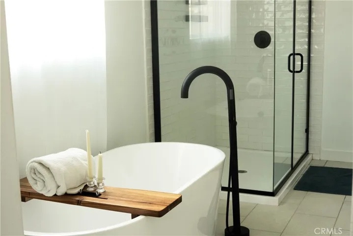 Bathroom tub and standing shower.