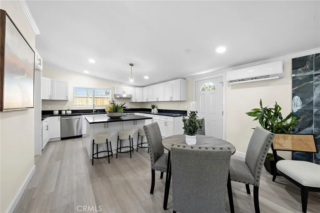Granite Kitchen with Center Island, Stainless Appliances, and Custom Self-Closing Cabinetry