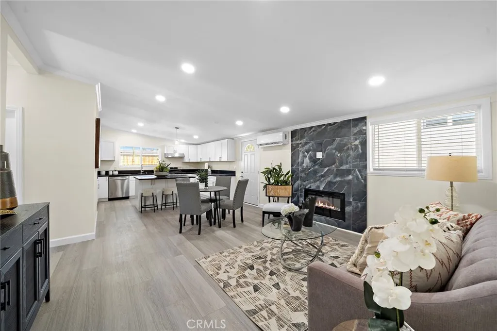 Open Concept Great Room Design Includes Living Room with Fireplace, Dining Area, New Granite Kitchen with Center Island