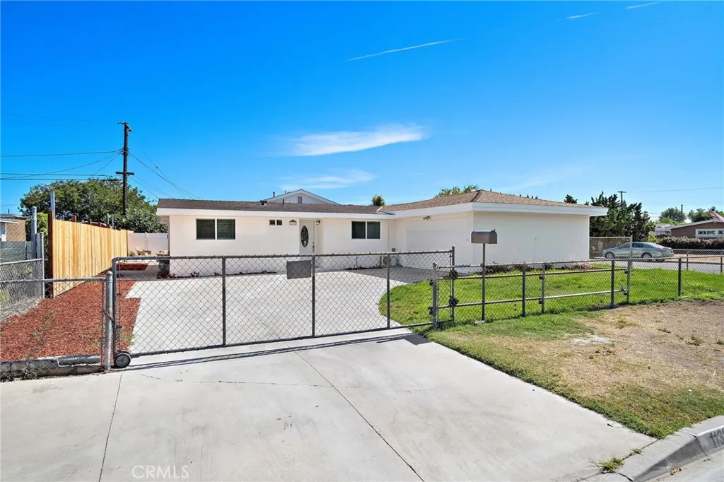 Interior corner lot with gated driveway