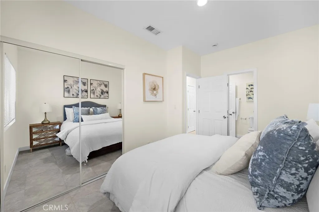 Bedroom #1 in ADU has mirrored closet doors