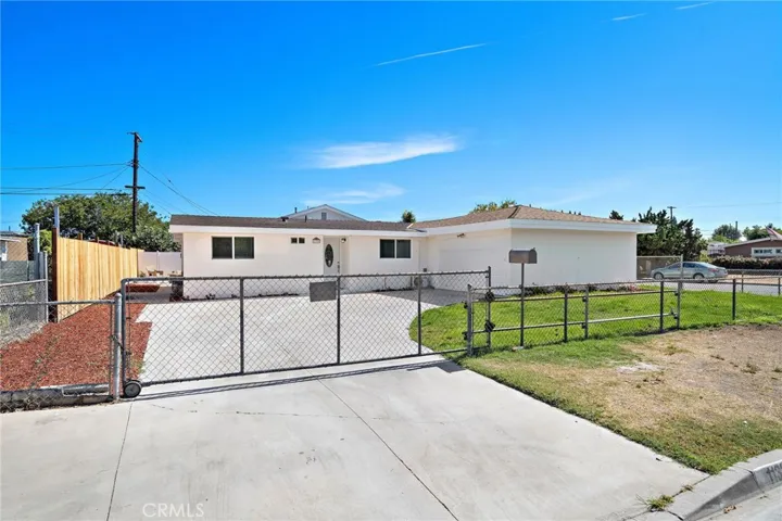 Interior corner lot with gated driveway