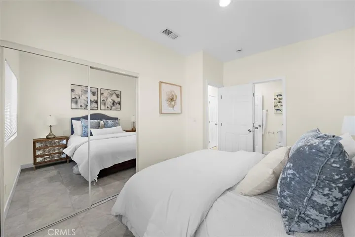 Bedroom #1 in ADU has mirrored closet doors