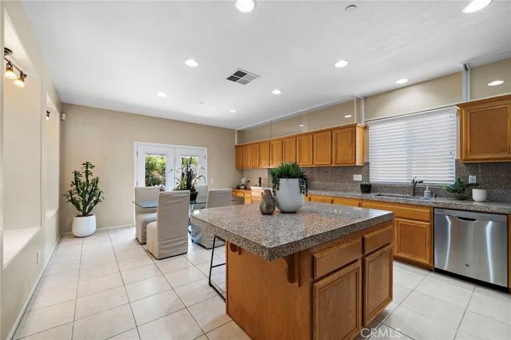 Recessed lighting and over head glass built in cabinet with lights that can change colors