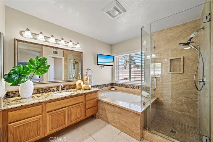 Primary suite - separate walk in shower and sunken bath tub