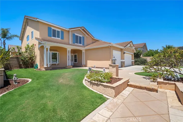 Exceptional curb appeal features a lush front lawn