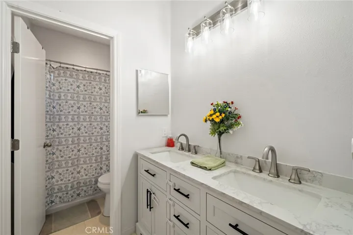 2 of 2 bathrooms bath shower combo - dual sinks