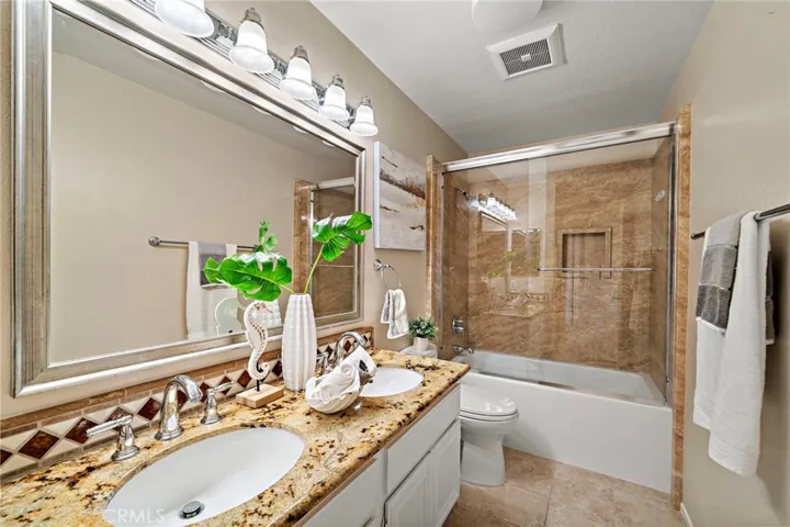 Upstairs hall bath -dual sinks and bath tub combo