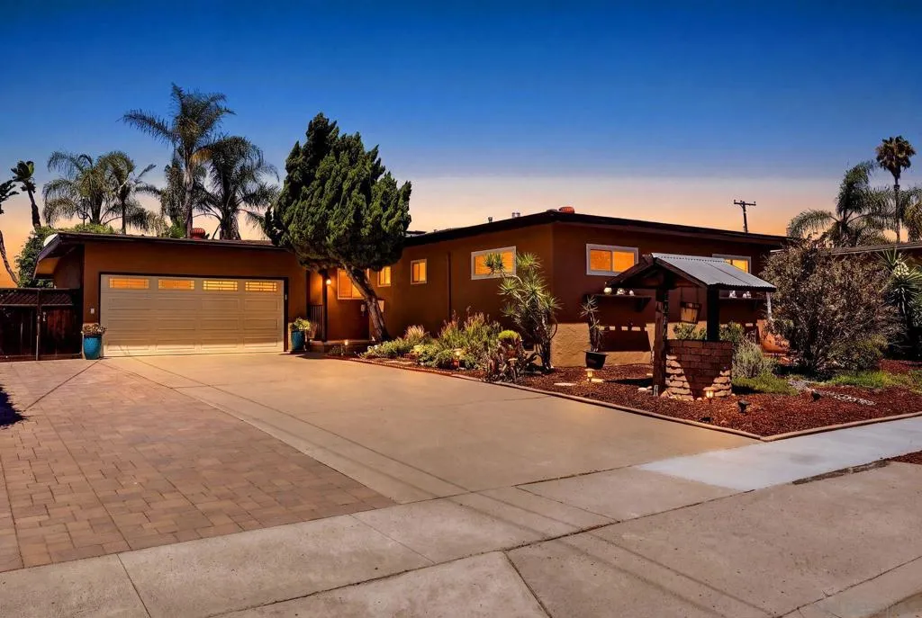 Wide driveway can fit three cars or a camper and two cars.