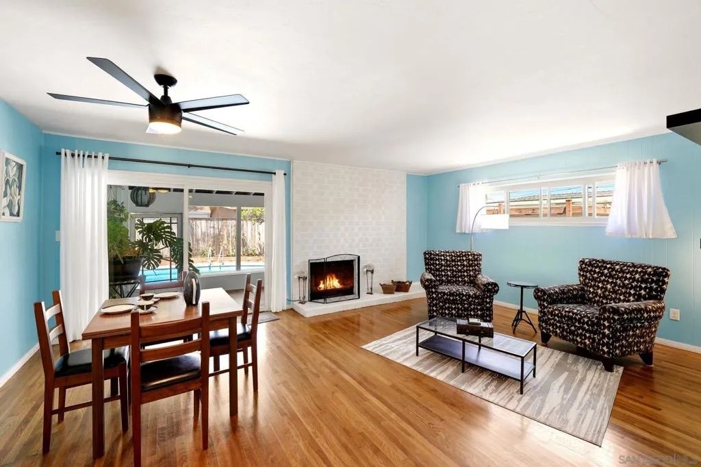 Original hardwood flooring with a fireplace.
