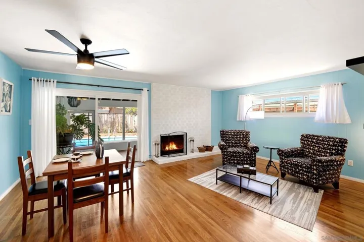 Original hardwood flooring with a fireplace.