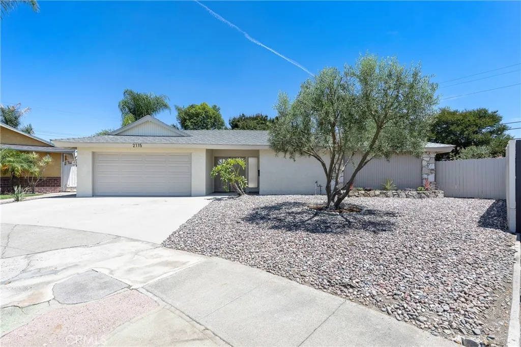 Your mid-century dream home with new paint and beautiful, low maintanence landscaping.