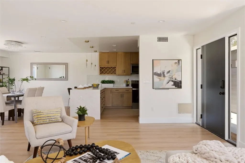 Kitchen opens to main living room and dining area, right off main entrance