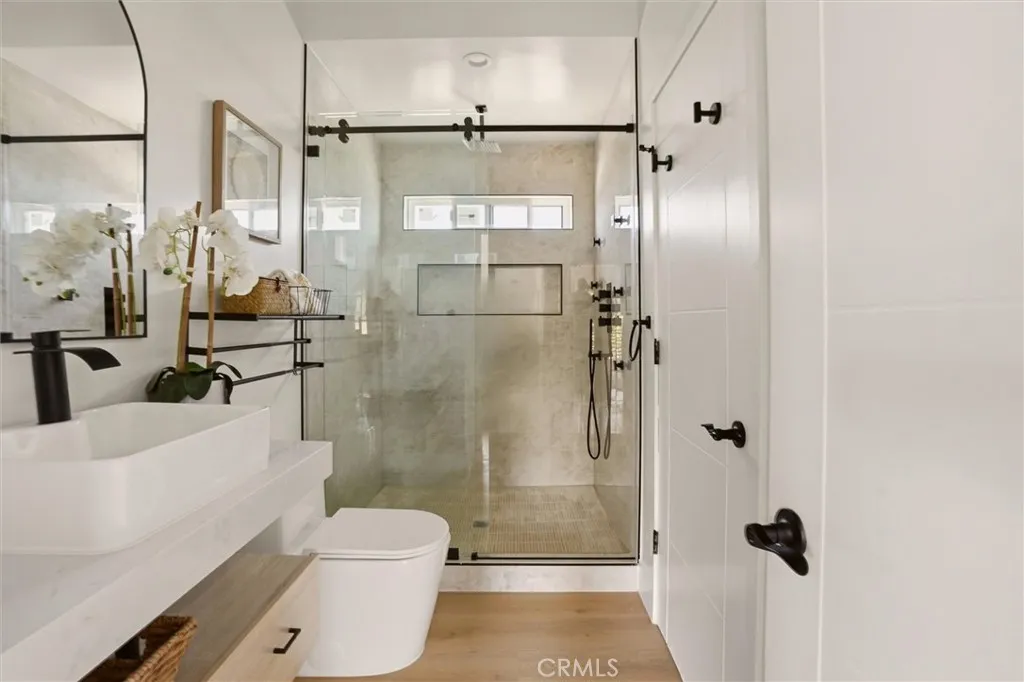 Second level bathroom with walk in shower and modern vanity