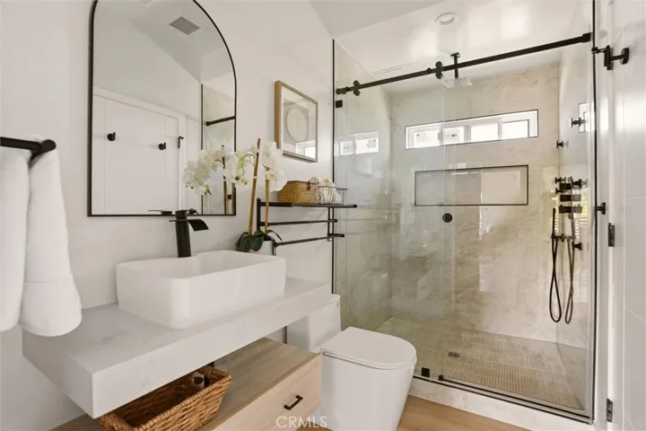 Second level bathroom with walk in shower and modern vanity