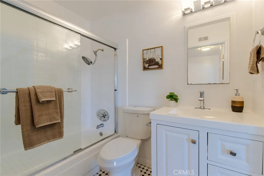 Bathroom with tub and vanity