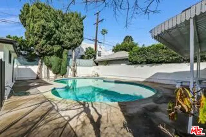 secured pool area +guest bath