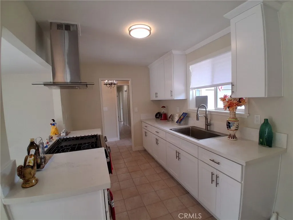 New Stainless-Steel Stove, Sink & Range Hood New Stainless-Steel Stove, Sink & Range Hood