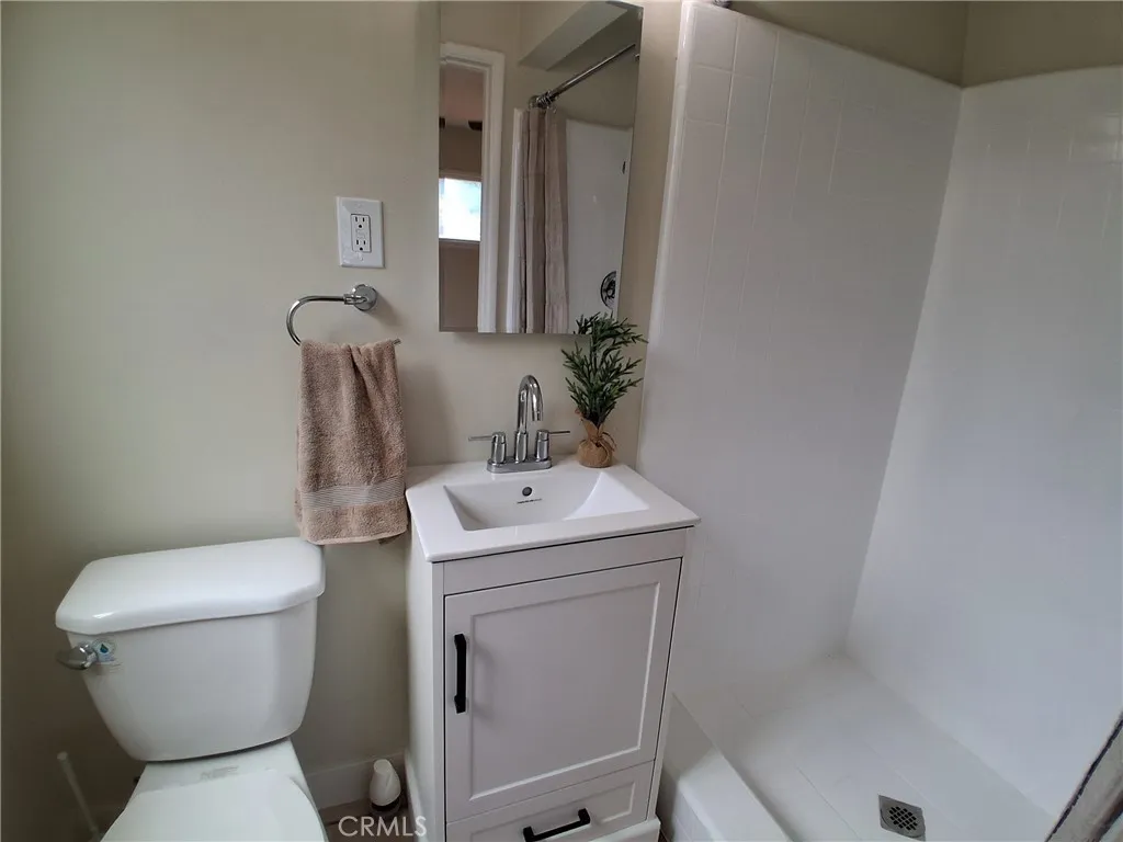 Updated primary bathroom with a fresh coat of tile glaze and paint Updated primary bathroom with a fresh coat of tile glaze and paint