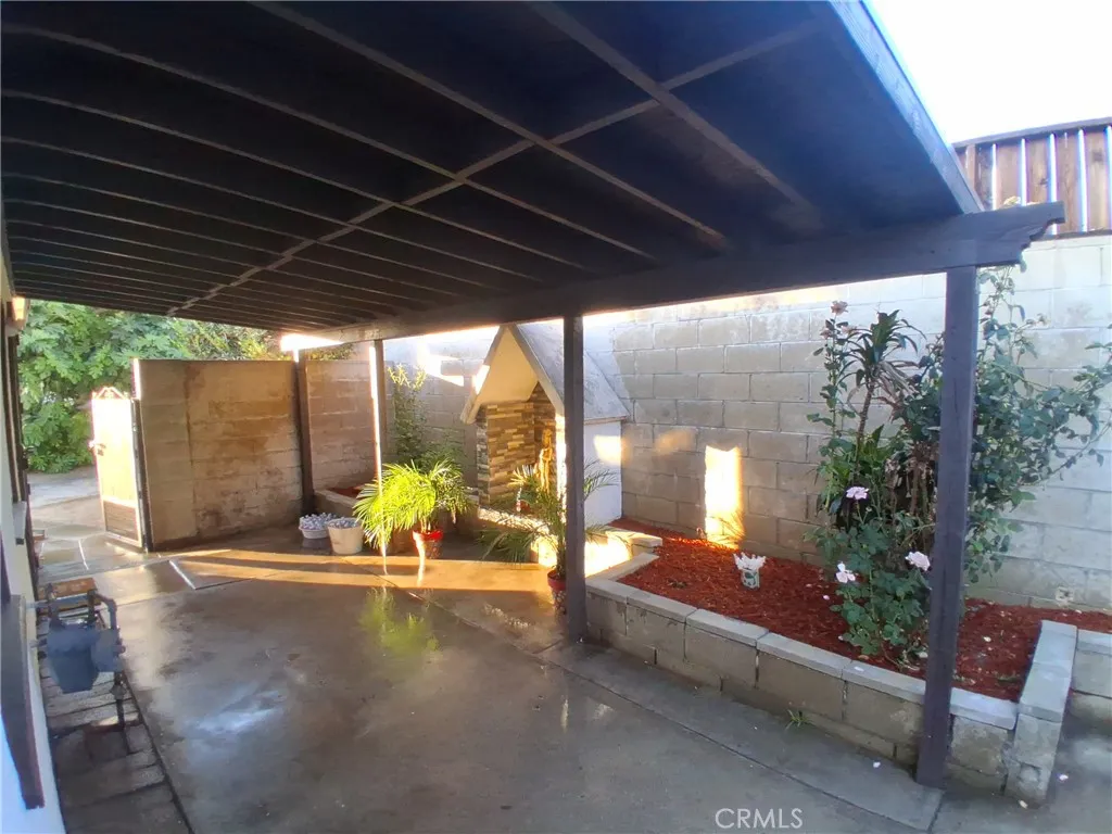Enjoy warm days in the shade on this cozy side patio—perfect for relaxing, enjoying a morning coffee, or entertaining guests. Enjoy warm days in the shade on this cozy side patio—perfect for relaxing, enjoying a morning coffee, or entertaining guests.