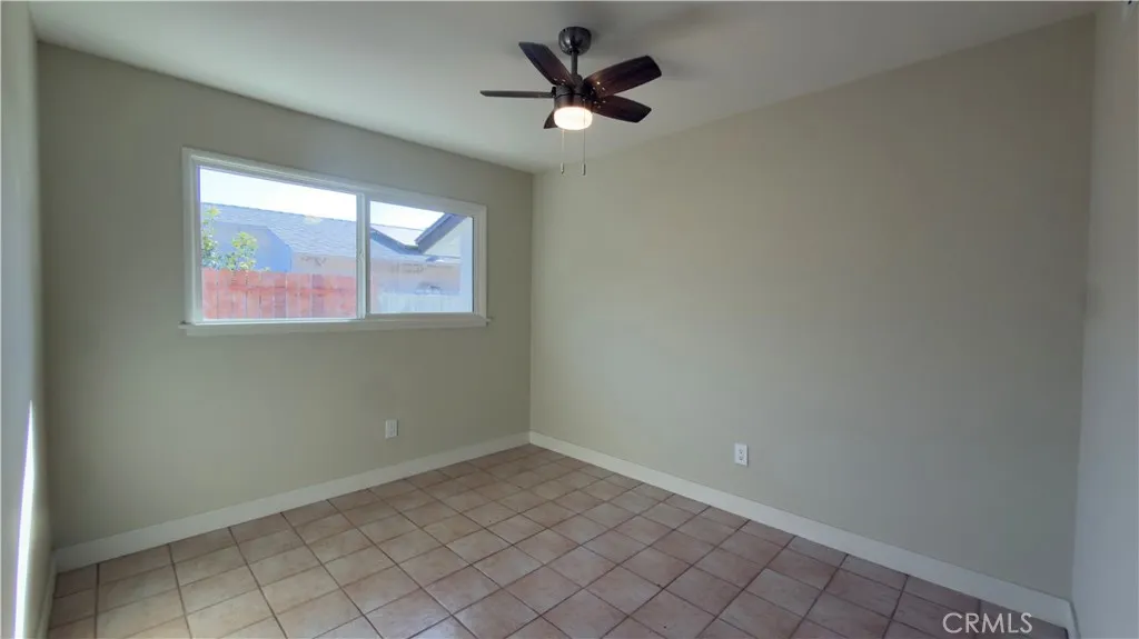 FIRST BEDROOM NEW PAINT AND CIELING FAN.