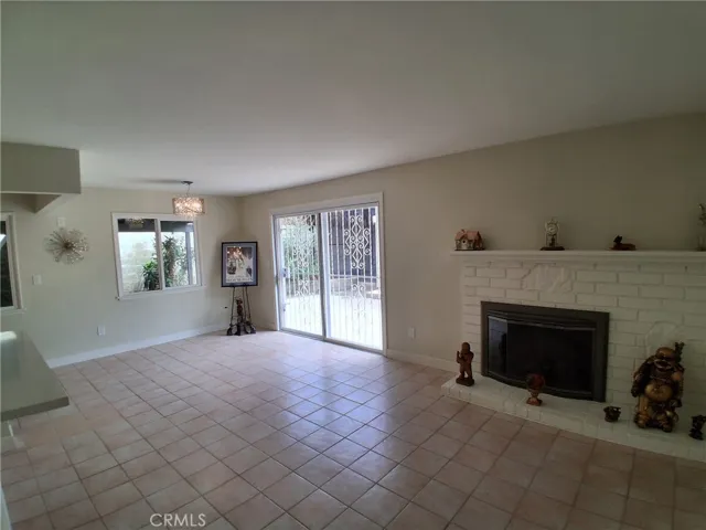 A beautiful classic fireplace adds warmth and character to this open, bright, and inviting home.