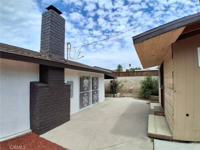 Enjoy the view of the private backyard, complete with convenient storage space.