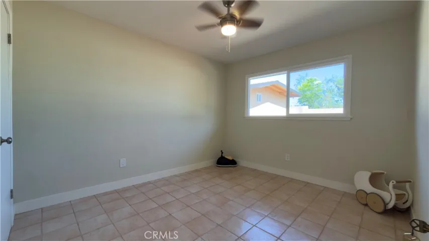 SECOND BEDROOM NEW PAINT AND CEILING FAN