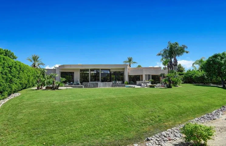 BACK OF HOME SHOWING YARD