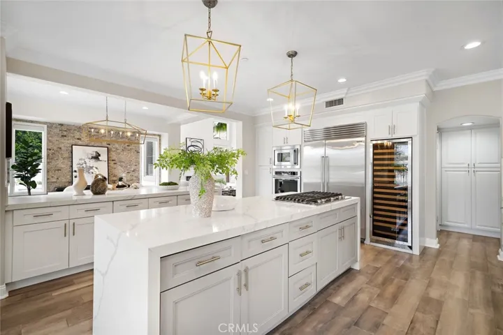 WOW!  The kitchen has 3 islands.