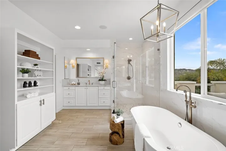 Amazing master bathroom, pedestal tub perfect for relaxing the day away.  Extra storage added no need for furniture.