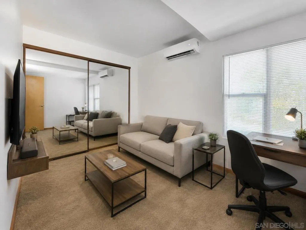 Virtually staged as living room-style in this bedroom.