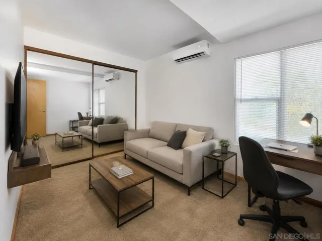 Virtually staged as living room-style in this bedroom.