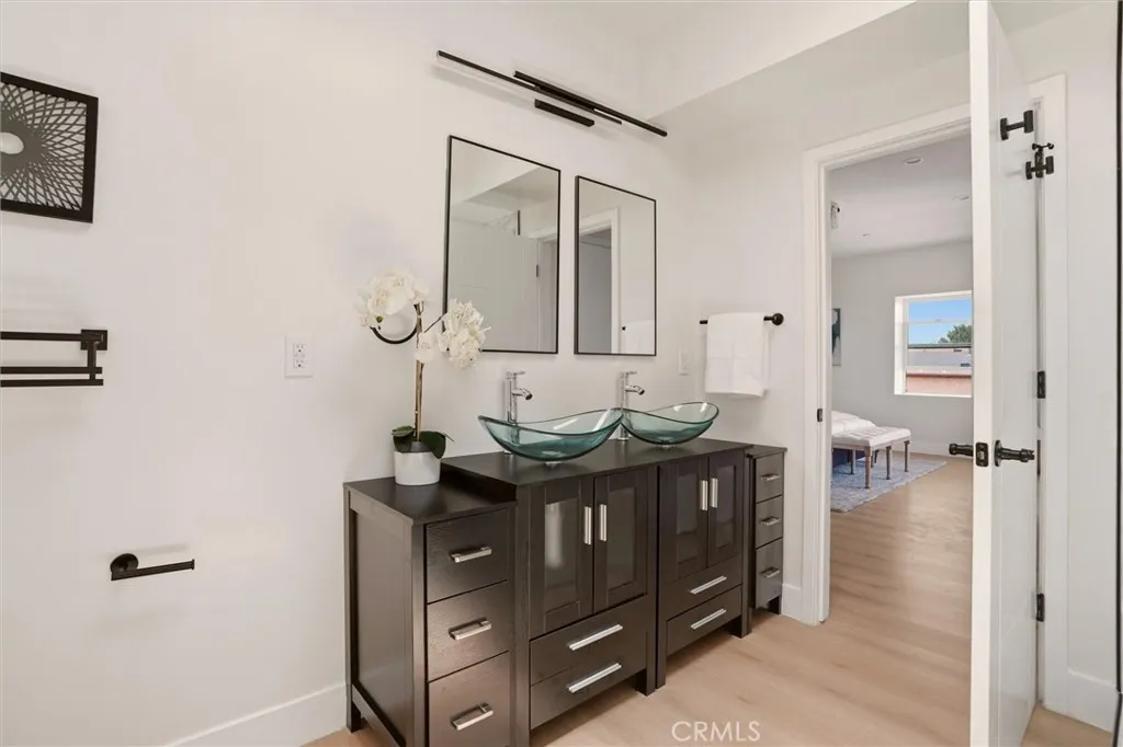 Double sinks in primary bathroom, photo from unit A (nearly identical units)