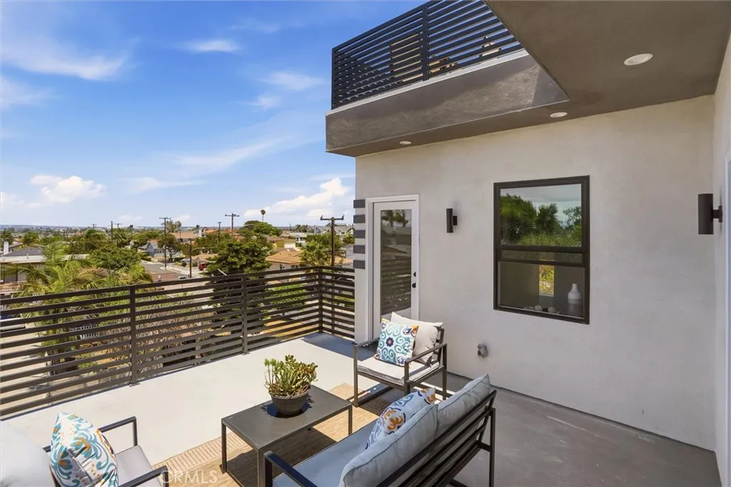 2nd level balcony off of 2nd floor living space, photo from unit A (nearly identical units)