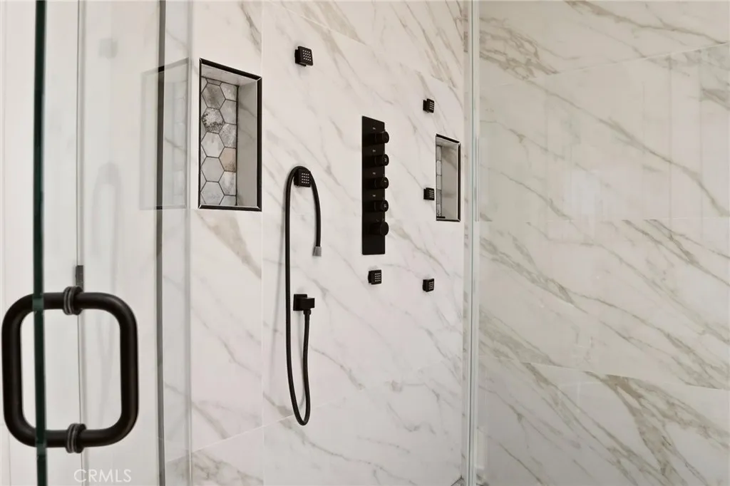 Modern shower in primary bathroom, photo from unit A (nearly identical units)